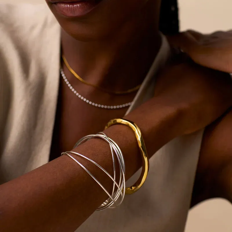 Orelia Polished Hammered Bangle in Gold