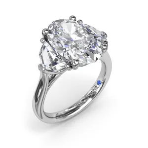 Three Stone Oval and Cadillac Engagement Ring