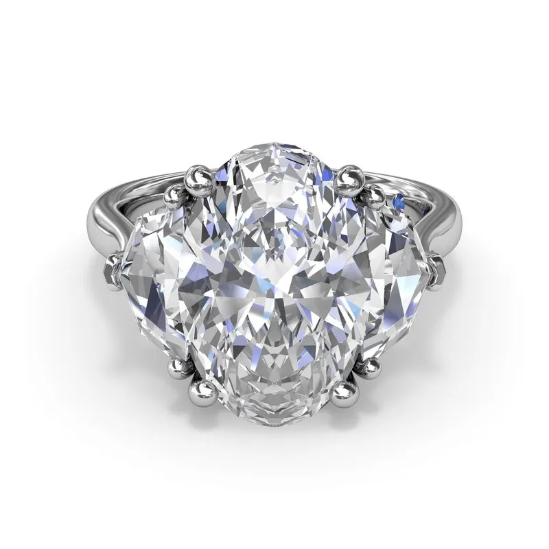 Three Stone Oval and Cadillac Engagement Ring