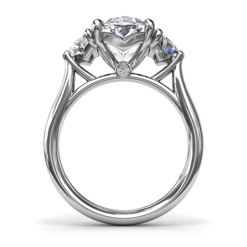 Three Stone Oval and Cadillac Engagement Ring