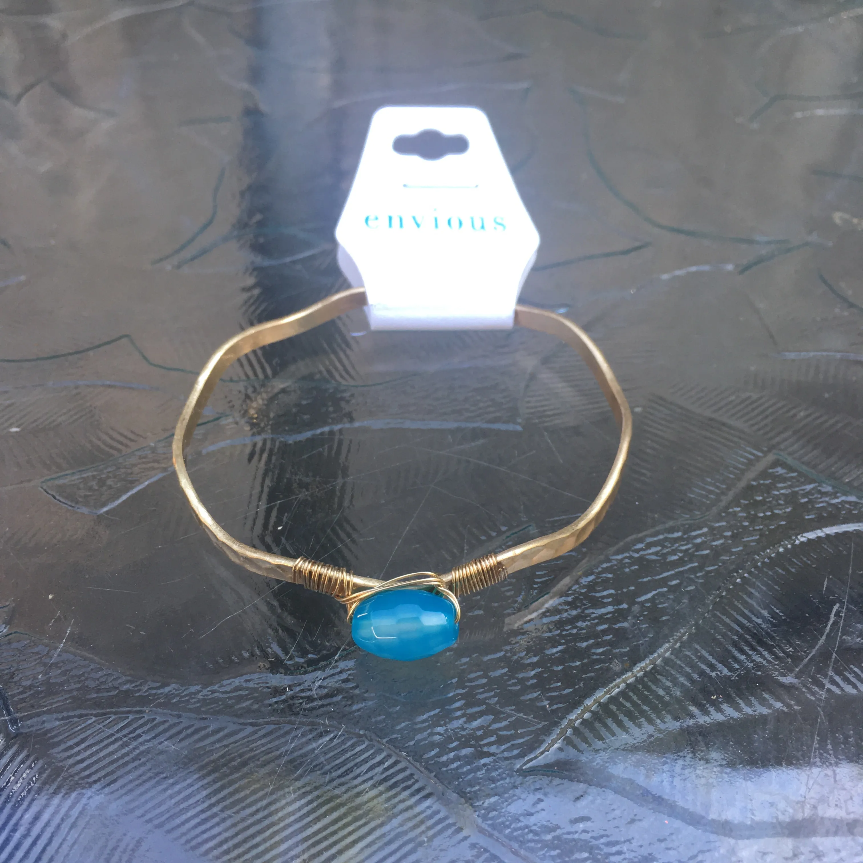Worn Gold Tone Wavy Latch Bangle with Stone- Blue