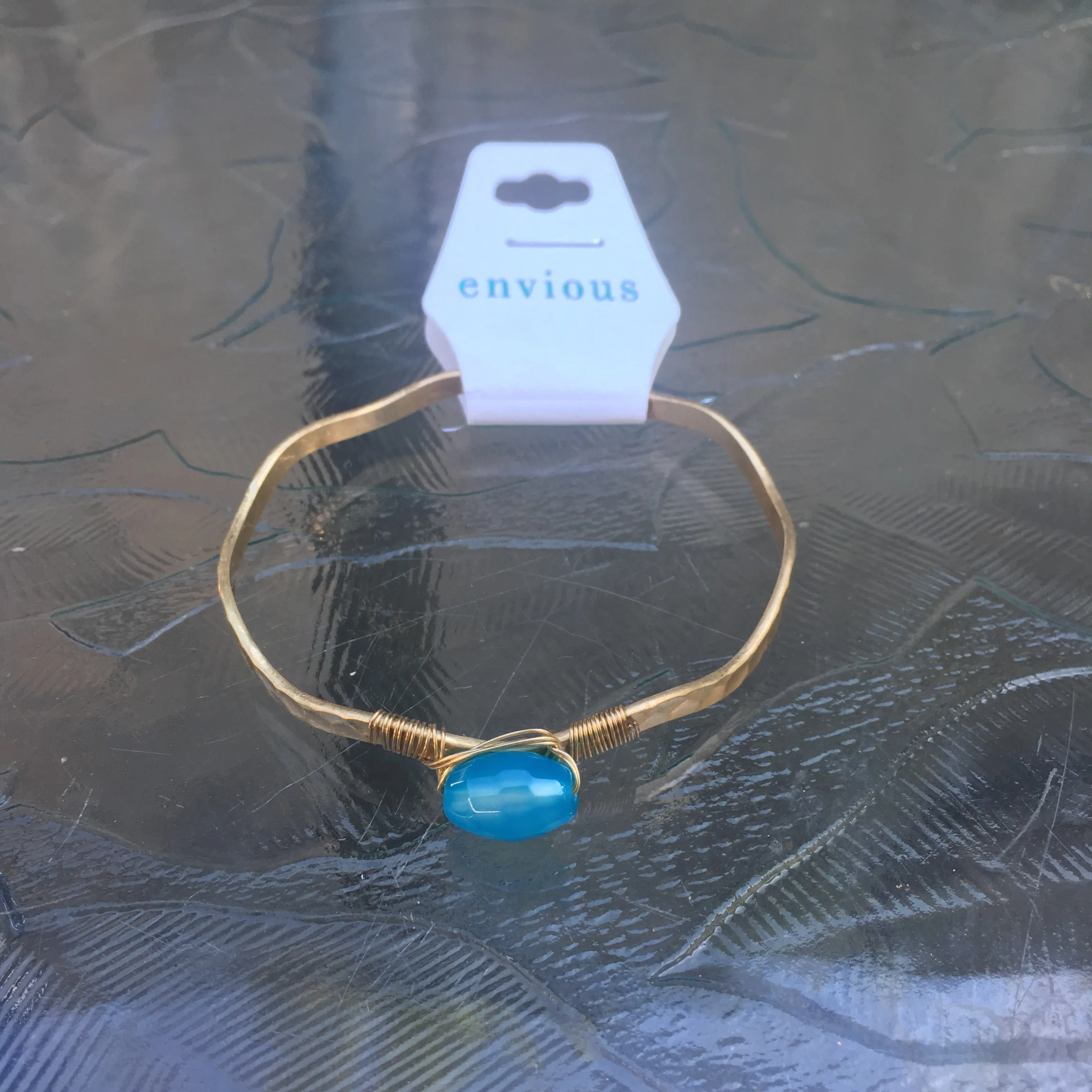 Worn Gold Tone Wavy Latch Bangle with Stone- Blue